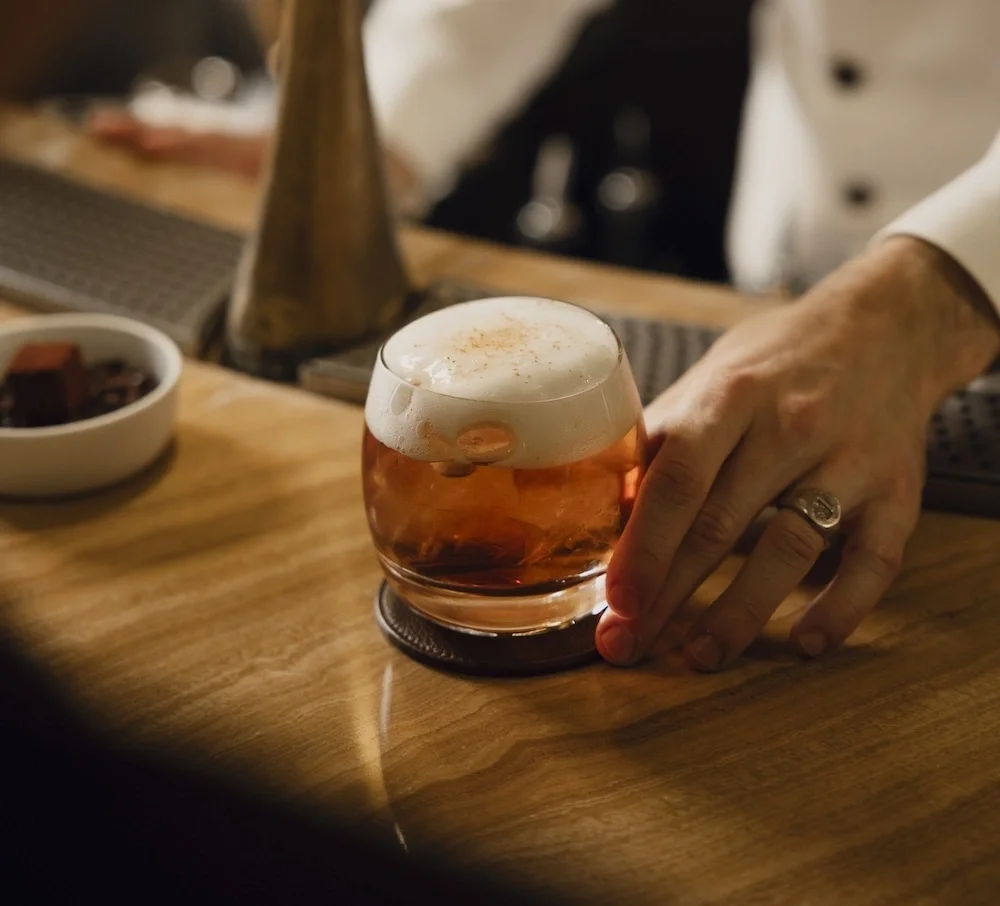 A cocktail is served at Bar Les Ambassadeurs