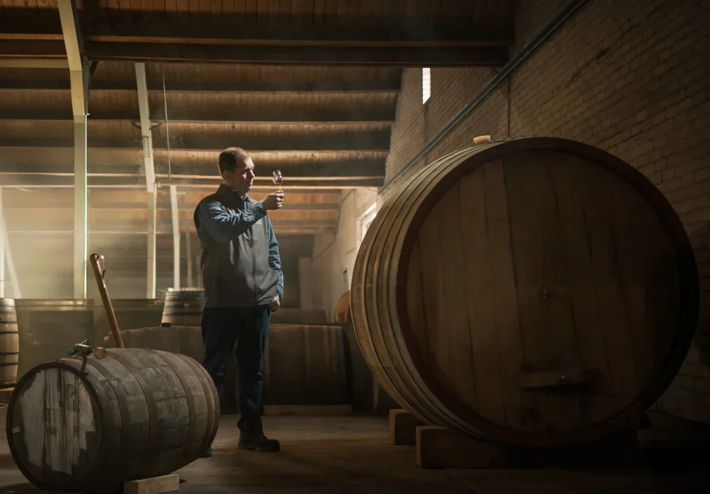 A man toasting a cask
