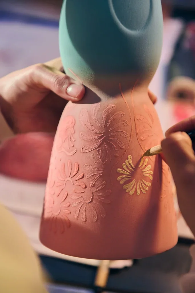 clase azul bottle being painted