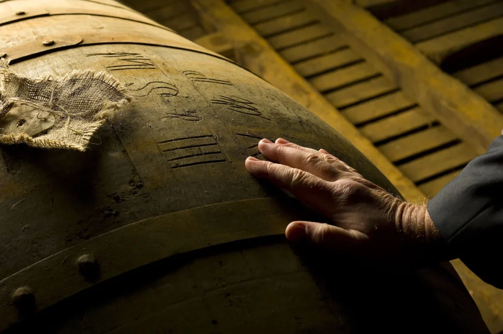 hand on a whisky cask